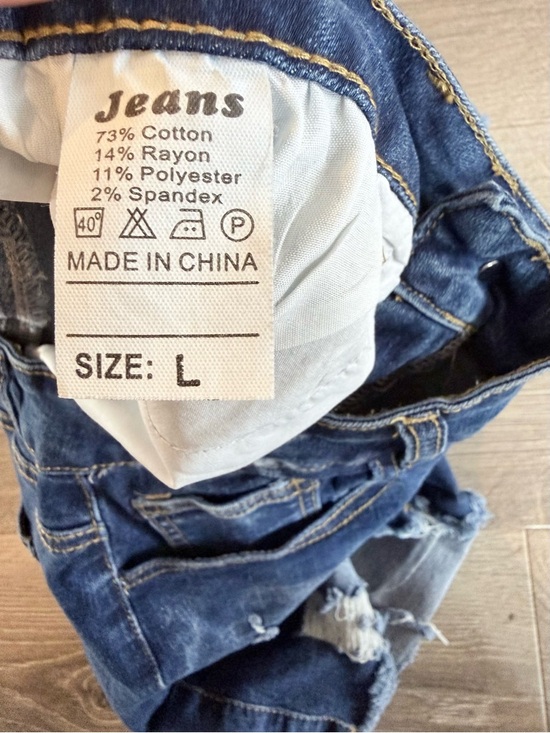 Distressed High-Rise Denim Shorts in Blue - Picture 6 of 7